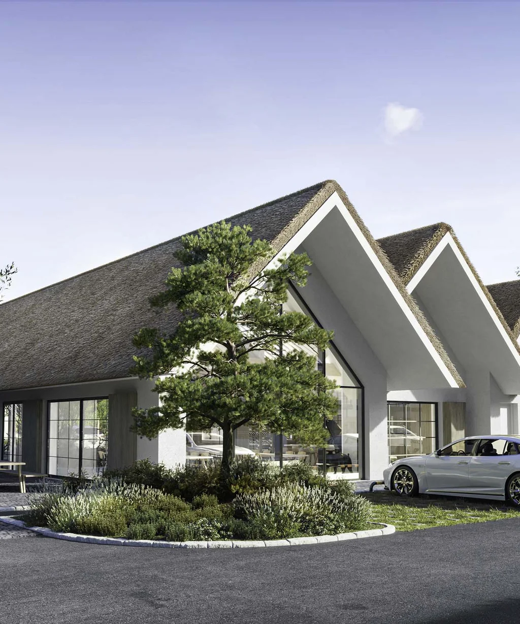 NILS am See: das Boutiquehotel am Neusiedler See Modernes Gebäude mit markanten dreieckigen Dächern und geparkten Autos